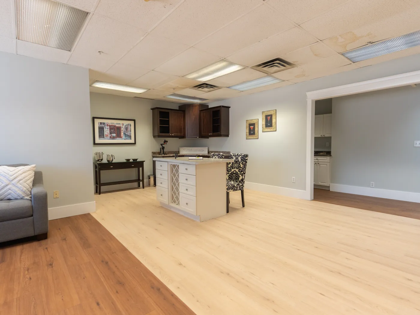 Kitchen island display showing two restored flooring products meeting at a clean transition