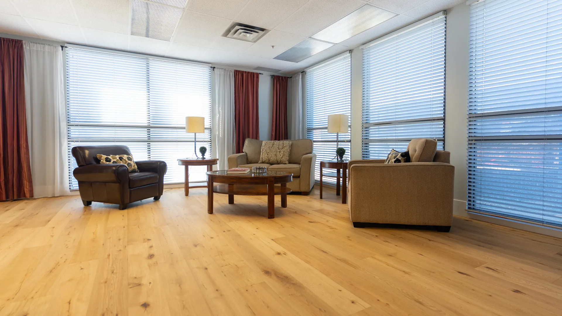 Restored wide plank oak flooring in the King of Floors showroom living room display