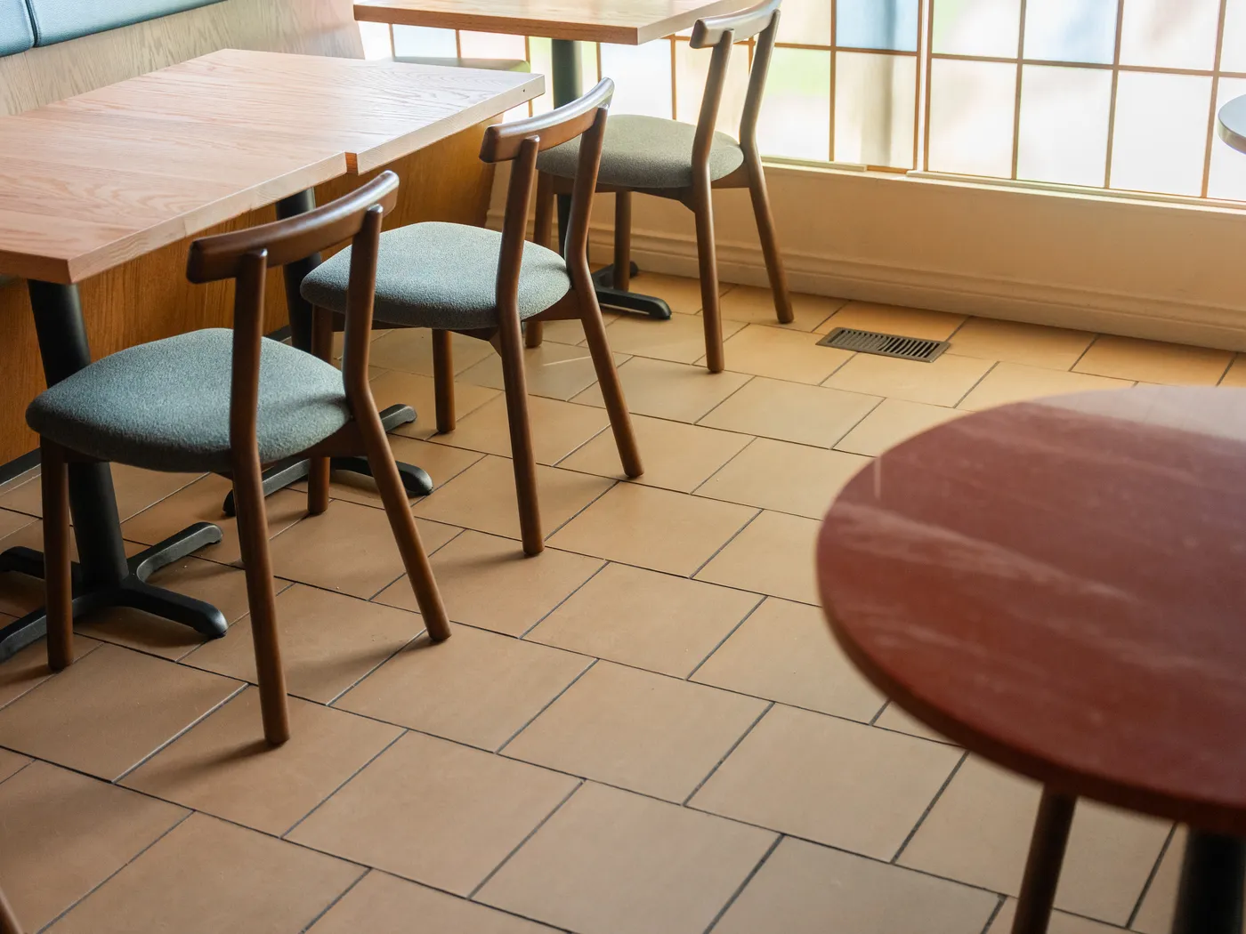 Restaurant tables and chairs on terracotta tile