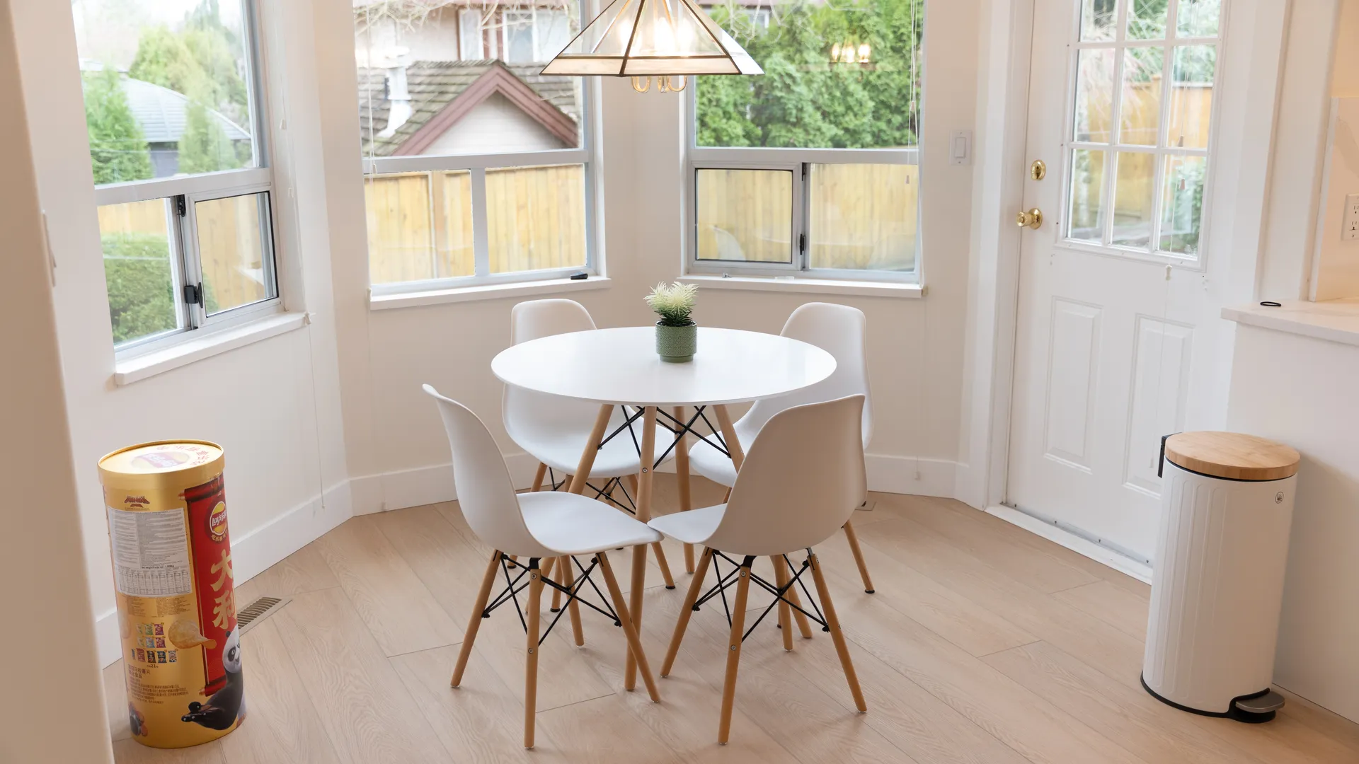 Bay-window dining nook with pendant light